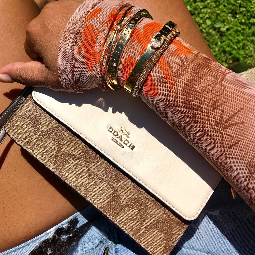 Coach wristlet/wallet. Stone with Coach monogram.